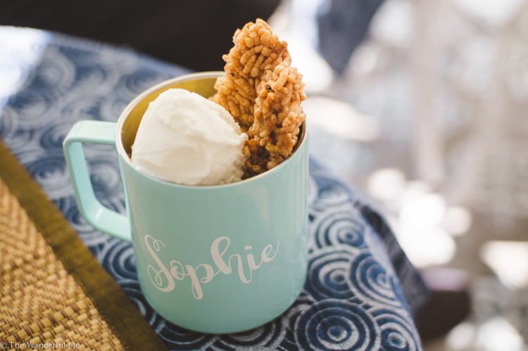 A sustainable reusable stainless steel mug filled to the brim with vegan coconut ice cream!