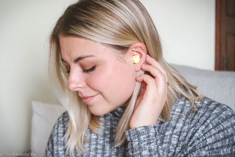 Sophie wearing ear plugs, which are most definitely a top thing to pack for a hostel. 