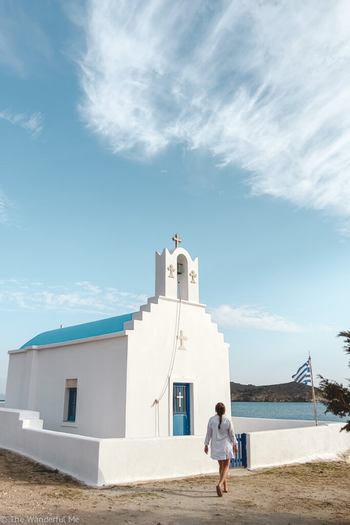 Sophie exploring a classic white-washed church on the island of Paros while island hopping in Greece for two weeks.
