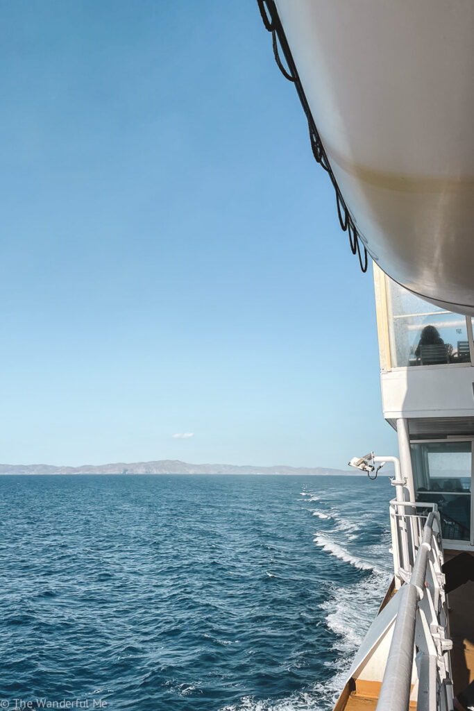 Riding a Blue Star Ferry with a view of the Aegean sea and Greek islands in the distance. | 14-Day Greek Island Hopping Route - The Wanderful Me