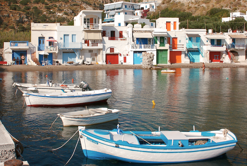 View of a small seaside village on the island of Milos in Greece. 