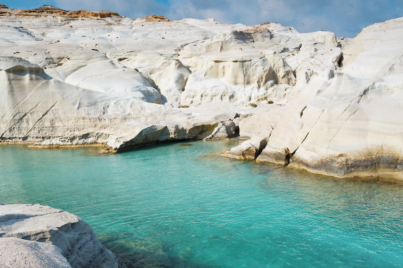 The otherworldly landscape of Milos. This is Sarakiniko Beach, one of the most popular beaches to visit when visiting Milos and island hopping in Greece. 